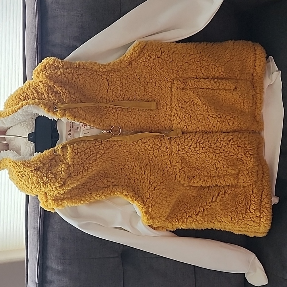 Crew neck sweatshirt with hooded vest.